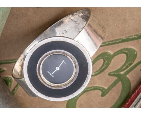 A c1980s Ruegg manual wind silver cuff bangle wristwatch, 36mm case with black enamel and having black dial, appears to run, 