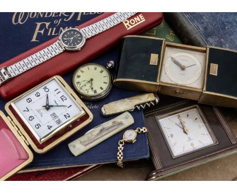 A first half of 20th Century silver open faced pocked watch and other timepieces, including two travel clocks and a small man