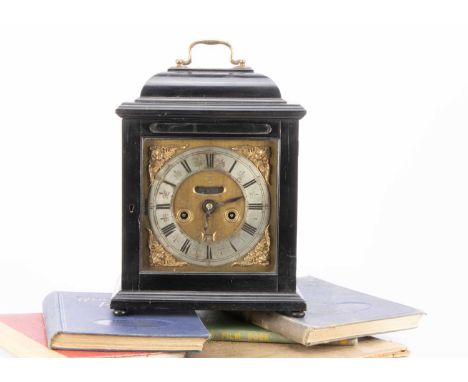 An early 18th century and later bracket style clock, marked John Clowes London, presented in a Victorian ebonised and glazed 