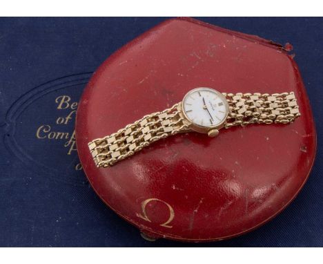 A 1960's 9ct gold Omega manual wind ladies wristwatch, 17mm case on integrated 9ct gold bracelet, 17.9g, appears to run, in r