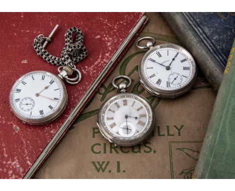 Three Victorian and later silver open faced pocket watches, one with silvered dial, and two with white enamel, one a Waltham,