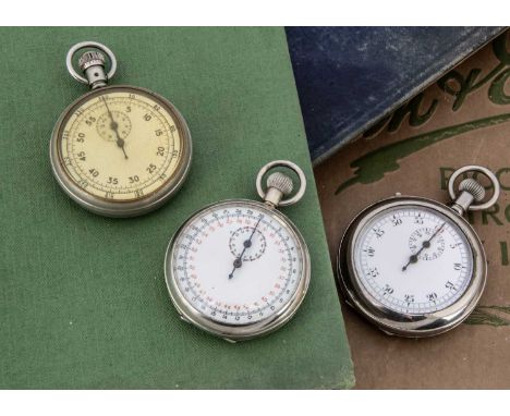 Three British military issue stopwatches, unmarked but each marked with broad arrow and numbers to reverses (3)