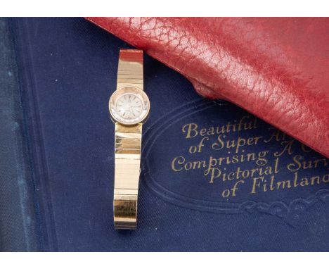 A c1960s Omega 18ct gold manual wind lady's cocktail dress wristwatch, 15.5mm circular case on integrated bar link bracelet, 