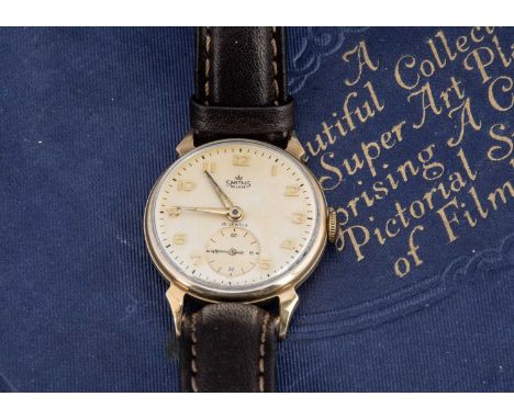 A 1950s Smiths De Luxe manual wind 9ct gold cased wristwatch, 31mm, cream dial with gilt numerals and subsiduary, appears to 