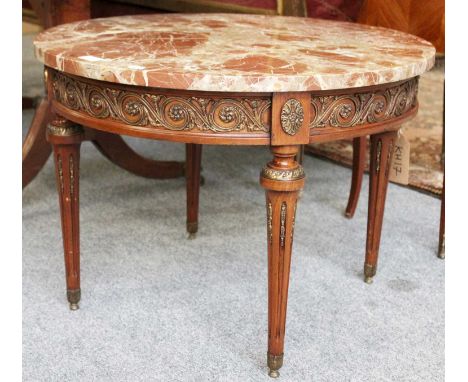 A French Louis XVI Style Marble Topped Circular Lamp Table, with gilt metal mounts and tapering fluted legs, 67cm by 48cm