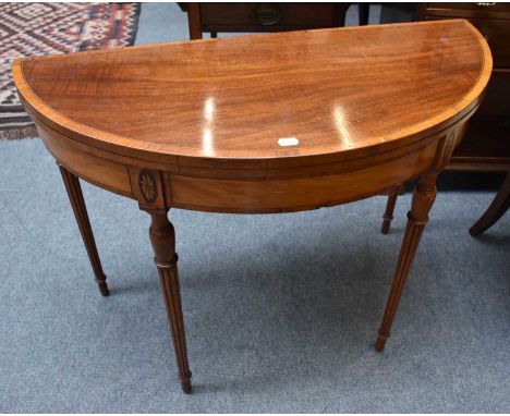 A 19th century Crossbanded Satinwood Demi Lune Fold Over Card Table, on tapering reeded legs, 99cm by 45cm by 75cm