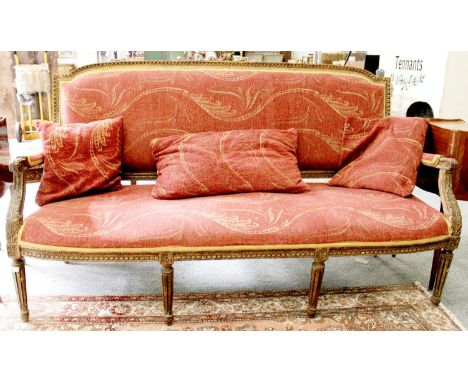 A French Louis XVI Gilt Framed Open Ended Sofa, with acanthus leaf decoration and tapering fluted legs, 174cm by 72cm by 102c