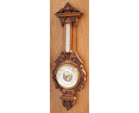 A Late Victorian Carved Oak Aneroid Barometer, 97cm highOak case in good order. Dials in fair condition. The thermometer tube