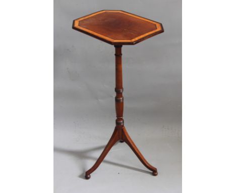 A Regency mahogany and boxwood banded tilt top lamp or wine table, the octagonal top over slender ring turned column and trip