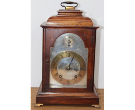 A Georgian style walnut bracket clock with caddy top, the silvered dial with brass chapter ring, 8-day movement, 32.5cm high