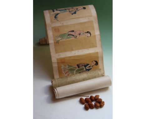 A Chinese hand pained scroll depicting courtesans in varying poses, ten subjects, 18 x 11cm, and nine Oriental carved beads. 