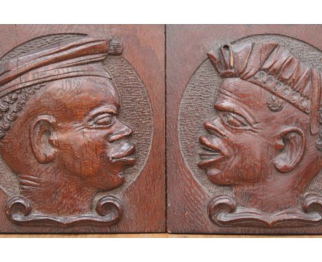 Two antique carved oak panels, each with a relief profile portrait of a Blackamoor, height 20cm