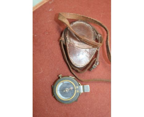 A World War I military marching compass, in leather case