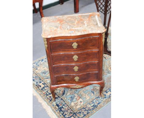 An ormolu mounted Louis IV style small four drawer commode, with shaped marble top