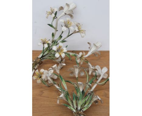 A pair of Continental polychrome tole twin light sconces in the form of flowering lilies, electrified, 40cm high