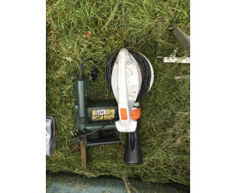 A small chainsaw and leaf blower