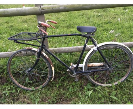 A Vintage trade bike with rack on front