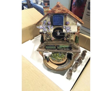 A boxed Flying Scotsman modern cuckoo clock as new in box.