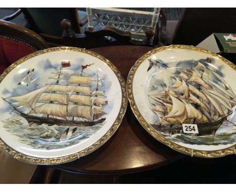 A pair of ceramic wall plates. decorated with sailing ships no damage.