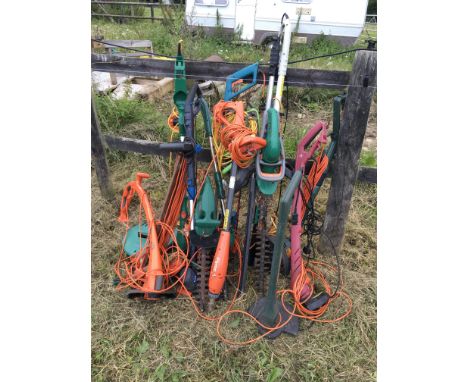 A collection of electrical garden tools including Flymo hoe strimmers and hedge cutters(a lot)