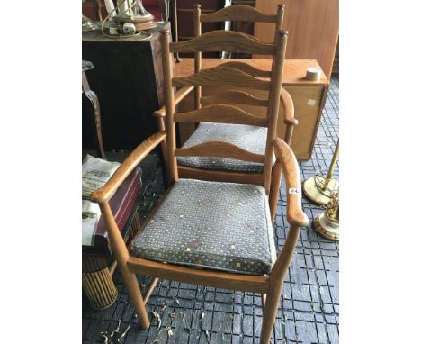 A Pair of Ercol elm ladder back open arm chairs. nice condition. (2)