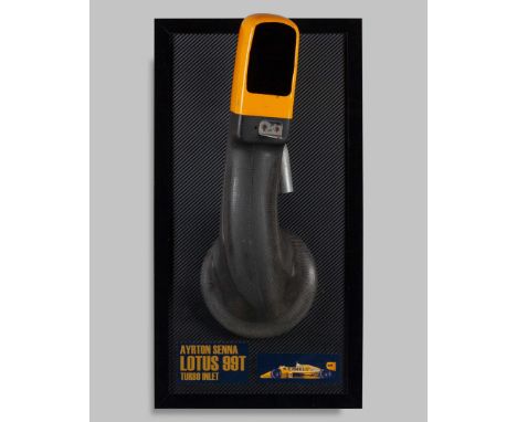 This Ayrton Senna 1987 Team Lotus Turbo Intake Display is a remarkable and rare piece of Formula 1 history, celebrating the l