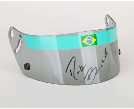 A signed and race-used visor worn by Rubens Barrichello during the 1995 season, when he drove for the Jordan Grand Prix team.