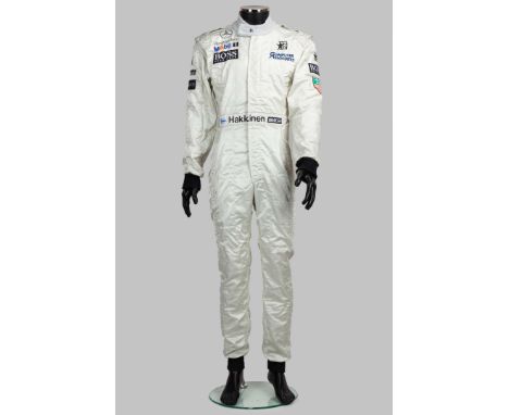 This Mika Häkkinen 1997 McLaren Race-Used Race Suit is a true piece of Formula 1 history, worn by the two-time F1 World Champ