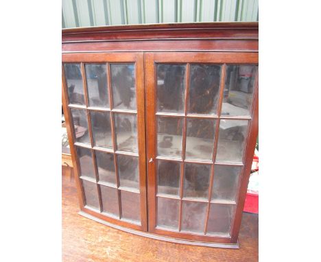 Edwardian mahogany bowfront wall-mounted display cabinet, with molded cornice above two 12 panel astragal molded doors, W66cm