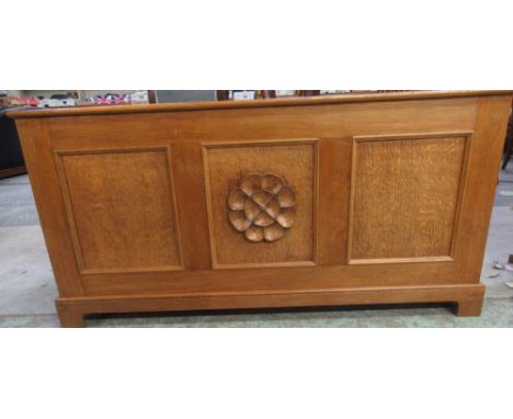 C20th panelled oak blanket box with hinged lid on bracket feet, front with relief carved rose W119cm D44cm H58cm 