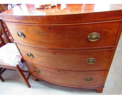 Geo. IV rosewood crossbanded mahogany bowfront chest of four long cockbeaded drawers, oval brass handles on shaped bracket fe
