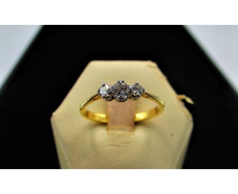 18ct gold three stone diamond ring Size R stamped 18, 2.6g gross 