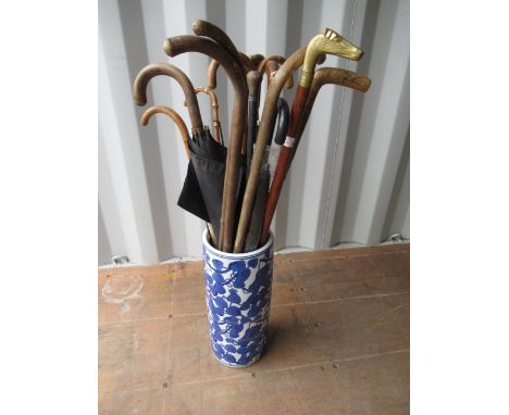 Walking stick with rams horn handle, another stick with composition with the head of a Labrador, another with brass dogs head