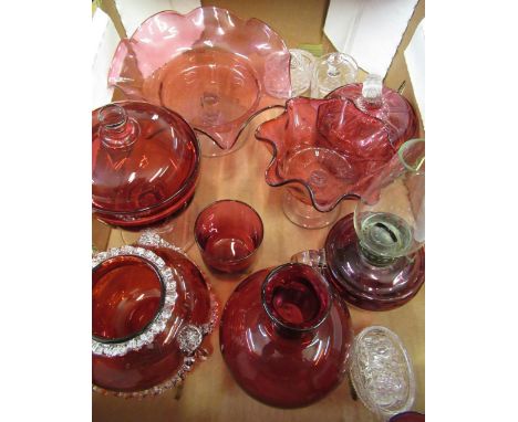 Late C19th hand held paraffin lamp with cranberry tinted bowl, late C19th cranberry glass bon bon dish on pedestal base and o