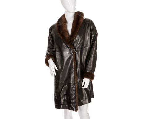 A fur-trimmed black leather coat, featuring ranch mink trim to include a lapel collar and cuffs, front button fastenings, two
