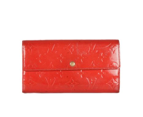 Louis Vuitton, a red monogram vernis Sarah wallet, designed with a red monogram embossed patent leather exterior, gold-tone h
