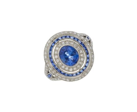 A platinum sapphire and diamond target dress ring, total sapphire weight 1.41ct, engraved to band, estimated total diamond we