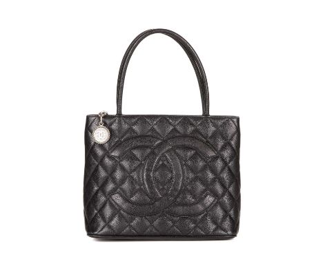 Chanel, a Timeless Medallion tote, crafted from black caviar leather with the maker's classic diamond quilting and large appl