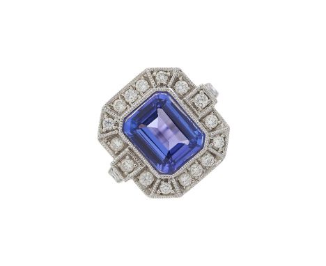 An 18ct gold tanzanite and diamond cluster dress ring, tanzanite estimated weight 3.25ct, estimated total diamond weight 0.40