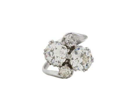 An early 20th century old-cut diamond crossover ring, with circular-cut diamond double highlight, principal two diamonds esti