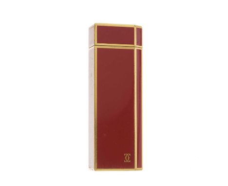 Cartier, an enamel lighter, designed with a gold-plated metal and burnt orange enamel casing, weight 102g, with maker's fitte