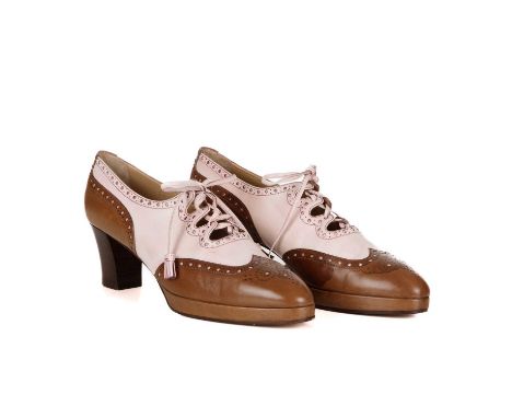 Hermes, a pair of vintage Ghillie Brogue heeled shoes, designed with pale pink and tan leather uppers, with lace-up fastening