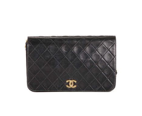 Chanel, a vintage CC Push Lock Full Flap handbag, designed with a diamond quilted black leather exterior, with 24k gold-plate