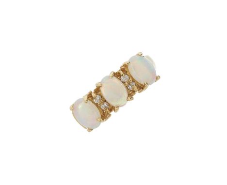 A 14ct gold opal cabochon three-stone dress ring, with brilliant-cut diamond double spacers, stamped 585, ring size O, 3.9gOv