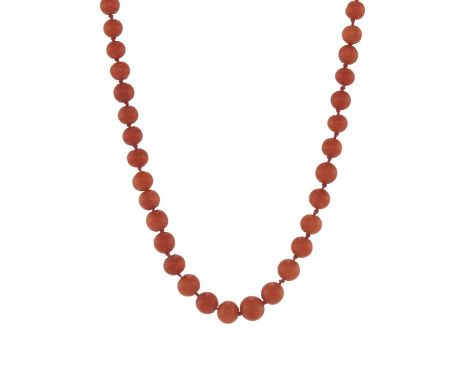 An early 20th century coral single-strand necklace, with coral cabochon accent gold push-piece clasp, diameter of coral beads
