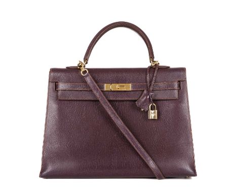 Hermes, a 2001 Kelly Sellier 35 handbag, crafted from Chevre Coromandel plum leather, with gold plated hardware, featuring a 