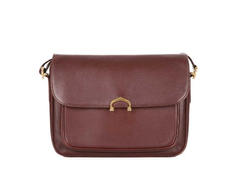 Cartier, a Bordeaux leather handbag, designed with a burgundy leather exterior, featuring gold-tone hardware, top flap closur