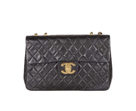 Chanel, a vintage Maxi Single Flap handbag, designed with a diamond quilted black leather exterior, with 24k gold plated hard