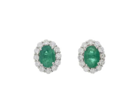 A pair of 18ct gold emerald and brilliant-cut diamond cluster stud earrings, estimated total emerald weight 1.40ct, estimated