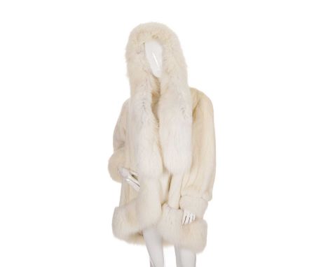 A white mink and fox fur hooded coat, featuring arctic fox fur trim and neck scarf, hook and eye fastenings, two outer pocket